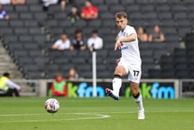 MK Dons are only five points off the play-offs despite their sluggish start.
