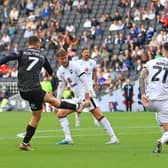 Doncaster Rovers are bottom of the Football League after defeat at MK Dons.