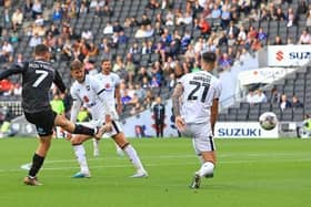 Doncaster Rovers are bottom of the Football League after defeat at MK Dons.