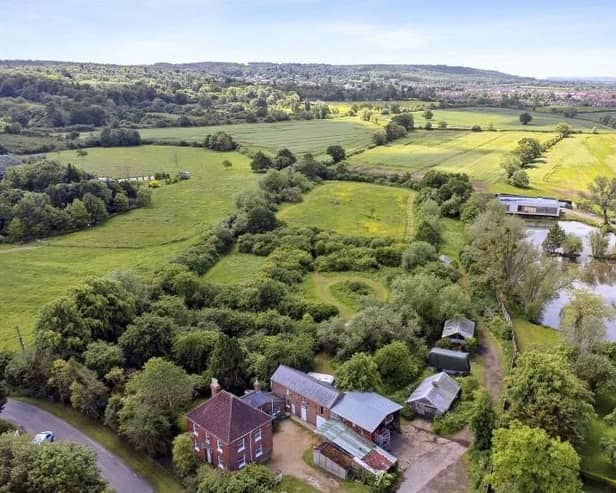 An aerial view looking over the farmhouse on Salford Road, on sale now with a guide price of £1,350,000
