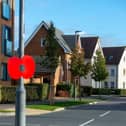 BG - SGB-6872 - A lamppost poppy at a Barratt and David Wilson Homes development