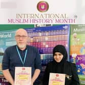 Maryam Jazeem and Mr. Garry Mitchell stand proudly with the IMHC official poster