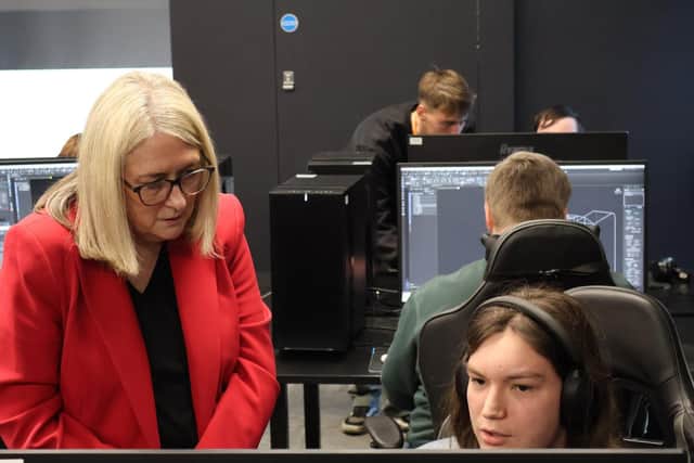 The minister with student Jarad Rampton studying for a Higher National Certificate in Games Development