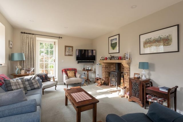 The cosy sitting room, with Clearview wood-burning stove is full of character features