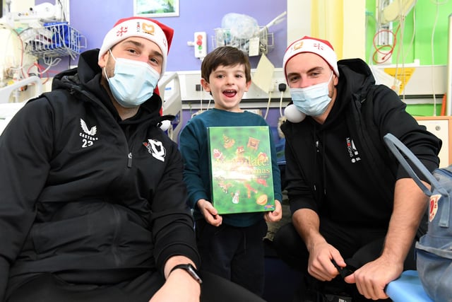 Franco and Jack with a youngster on the ward