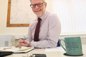 Darren Roe at desk