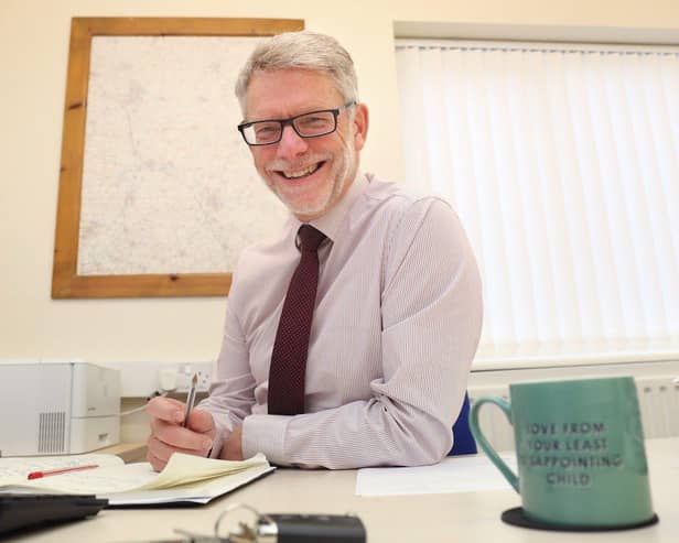 Darren Roe at desk