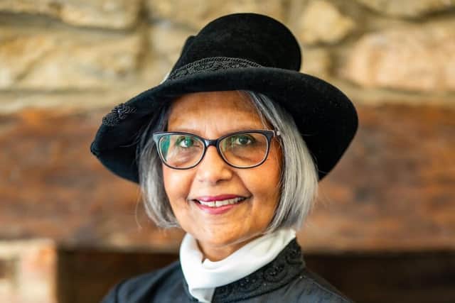 Kurshida's court dress reflects her Islamic faith and her Asian culture and heritage