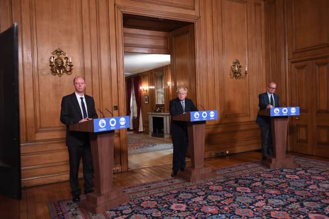 Prime Minister Boris Johnson (centre), Chief Medical Officer for England Chris Whitty (left) and Chief Scientific Adviser Patrick Vallance (right) attend a virtual press conference at Downing Street (Photo: STEFAN ROUSSEAU/POOL/AFP via Getty Images)