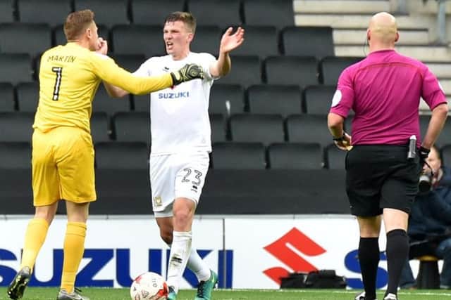 Downing and David Martin had an on-pitch spat in Karl Robinson's final game - a 3-0 defeat to Southend