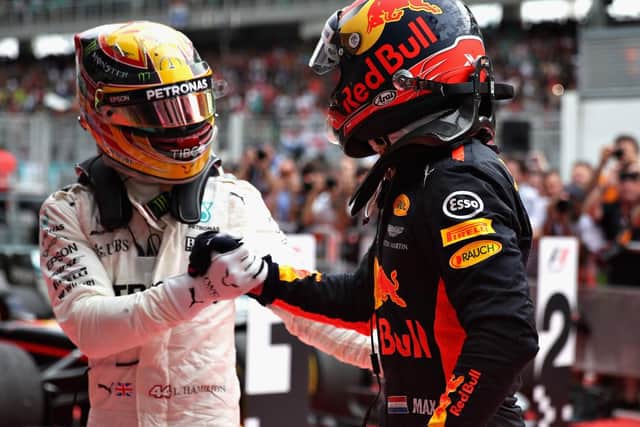 Verstappen is congratulated by Lewis Hamilton