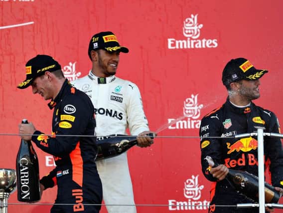 Verstappen and Ricciardo celebrate with Lewis Hamilton in Japan