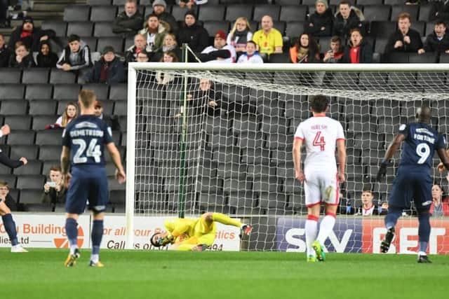 Lee Nicholls saves Josh Wright's early penalty. Picture by Jane Russell