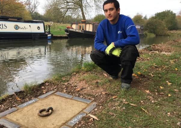Canal operative Tristan Owen with a mooring ring