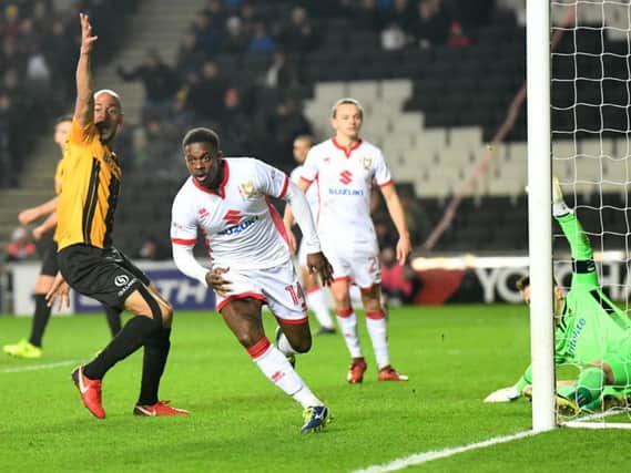 Kieran Agard celebrates after scoring for MK Dons in their win over Maidstone United (Pictures: Jane Russell)