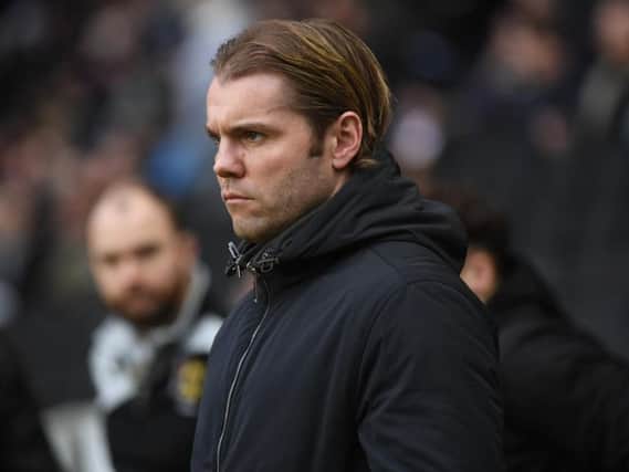 Robbie Neilson watches on as his side lost to Plymouth on Saturday