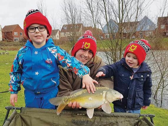 Richard Purnell and his young 'uns enjoyed New Year's Eve with a trio of small carp. And he fell in...much to the kids' delight