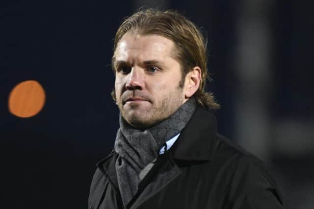 Robbie Neilson walks off for the final time as Dons manager