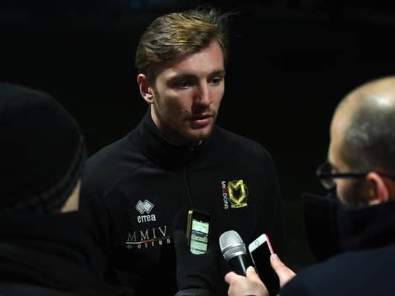 Alex Gilbey speaks to the media