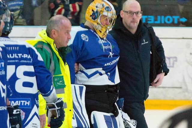 Miika Wiikman is helped from the ice
Pic: Tony Sargent