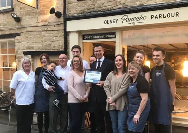 Olney Pancake Parlour staff were presented with their award by MP Mark Lancaster