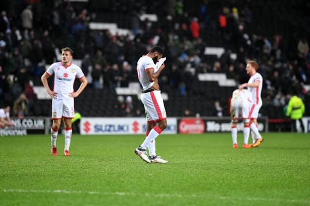 MK Dons stand stunned after losing to Portsmouth
