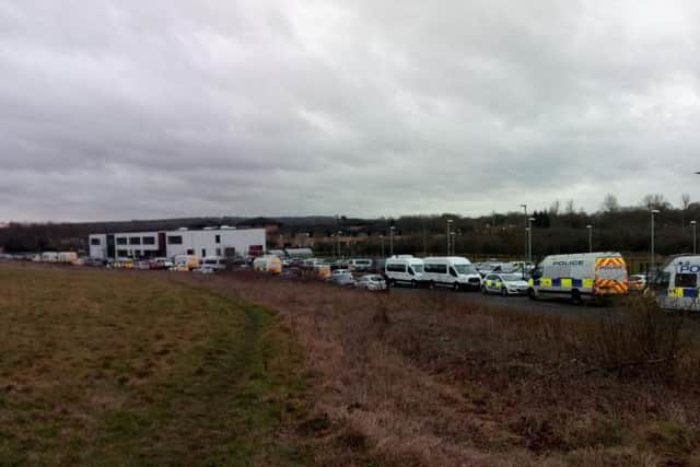 Police left the primary school where they were briefed to execute 20 warrants across the city