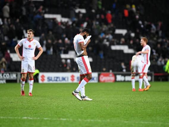 MK Dons looking glum after losing to Portsmouth