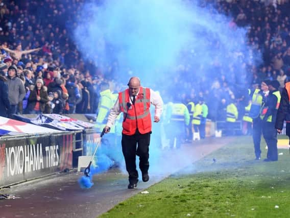 Smoke grenades were thrown during the game against Portsmouth