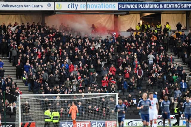 Charlton fans let off white and red smoke grenades last Saturday