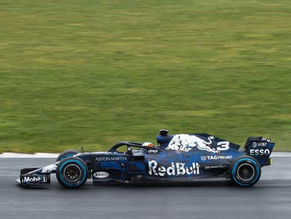 Daniel Ricciardo gets his hands on the 'special liveried' RB14