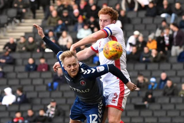 Lewington battles with Charlton's Ben Reeves