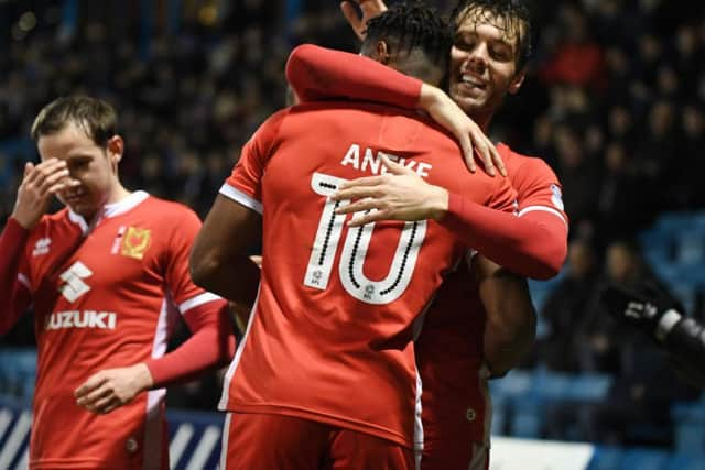 Ward celebrates with Chuks Aneke at Gillingham