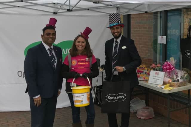 Julie Carter with the team at Specsavers Newport Pagnell for Wear A Hat Day