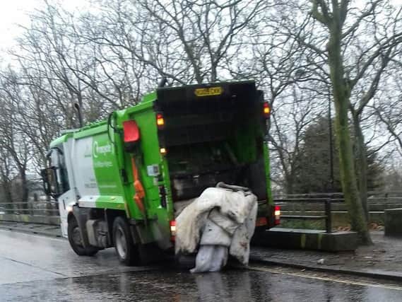Bedding being taken away at the 'clean-up'