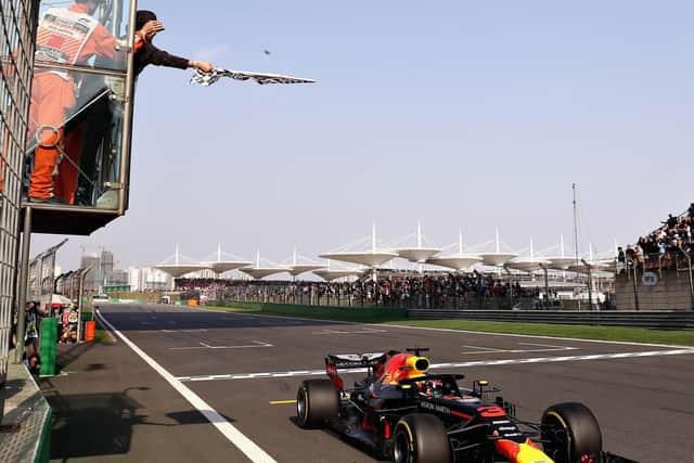 Ricciardo crosses the line in Shanghai
