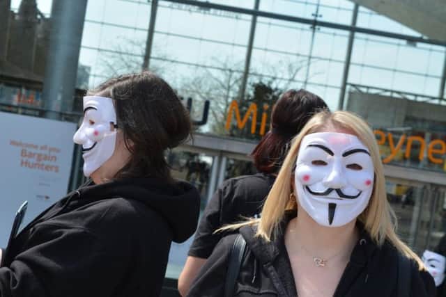Demonstrators engaged with shoppers in Central Milton Keynes