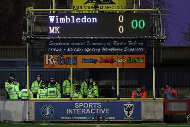 The scoreboard at AFC Wimbledon during the game with MK Dons