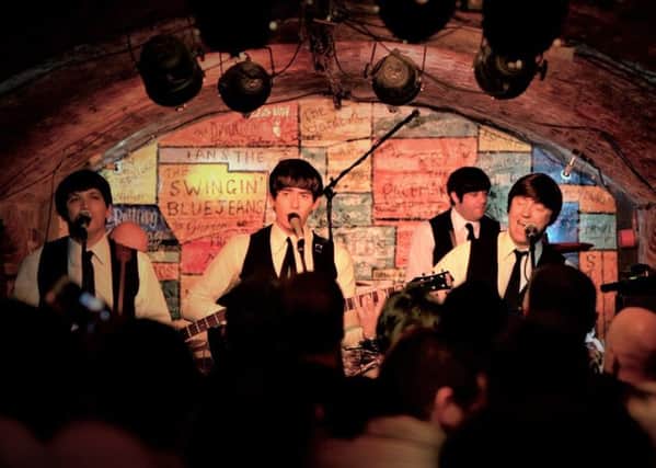 The Mersey Beatles performing at the Cavern Club in Liverpool