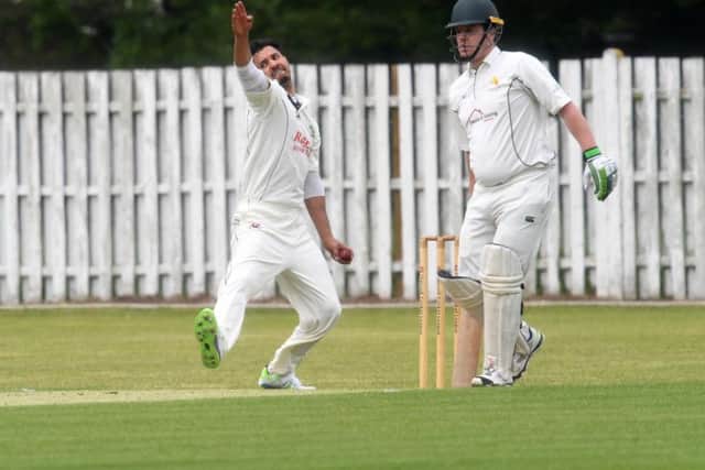 Haroon Malik bowls for Wolverton