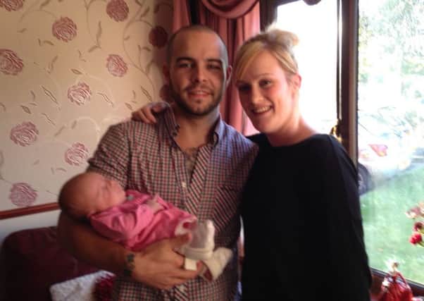 Tommy and Tanya Meagers first family photo with their new baby girl Sienna