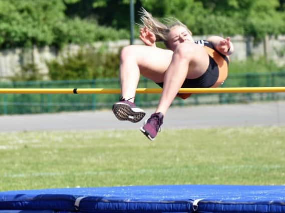 Kayleigh Presswell in high jump action