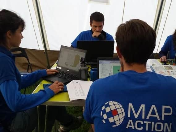 A team of volunteers maps the evolving situation using geographic information system (GIS) software