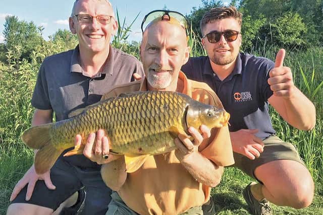 IAN Pledger and buddies putting their 'recue carp' back into Lodge