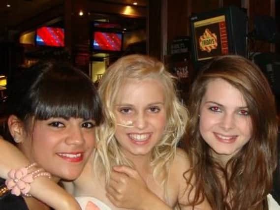 Chloe Baker (centre) and her friends