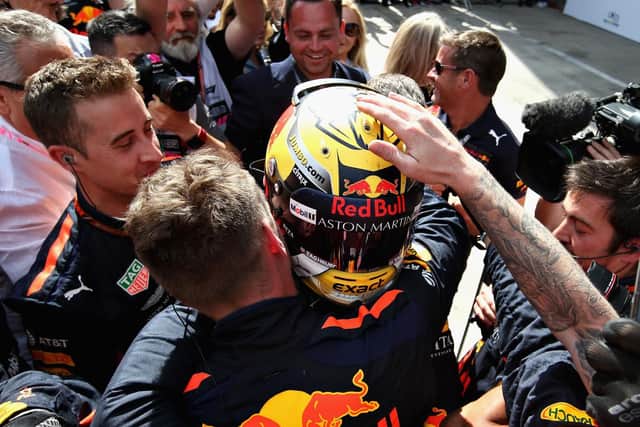 Verstappen celebrates with his team