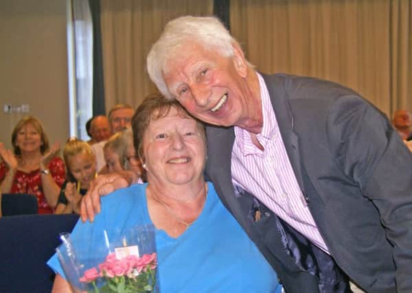Jackie Starkey, organiser of the Disabled Swimming Club and Rotarian Bill Blyth of the Swimathon Committee.
