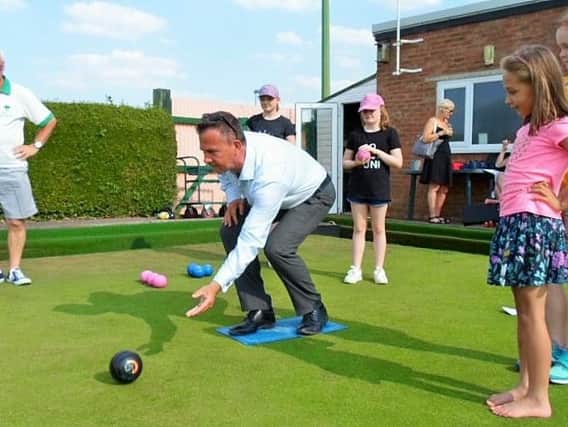 Mark Lancaster MP is put throught his bowling paces