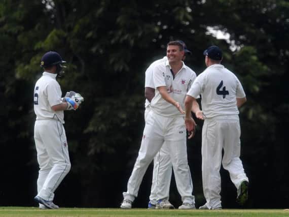 Milton Keynes celebrate a wicket against New Bradwell