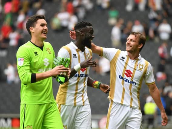 Lee Nicholls, Ouss Cisse and Alex Gilbey celebrate the win over Bury